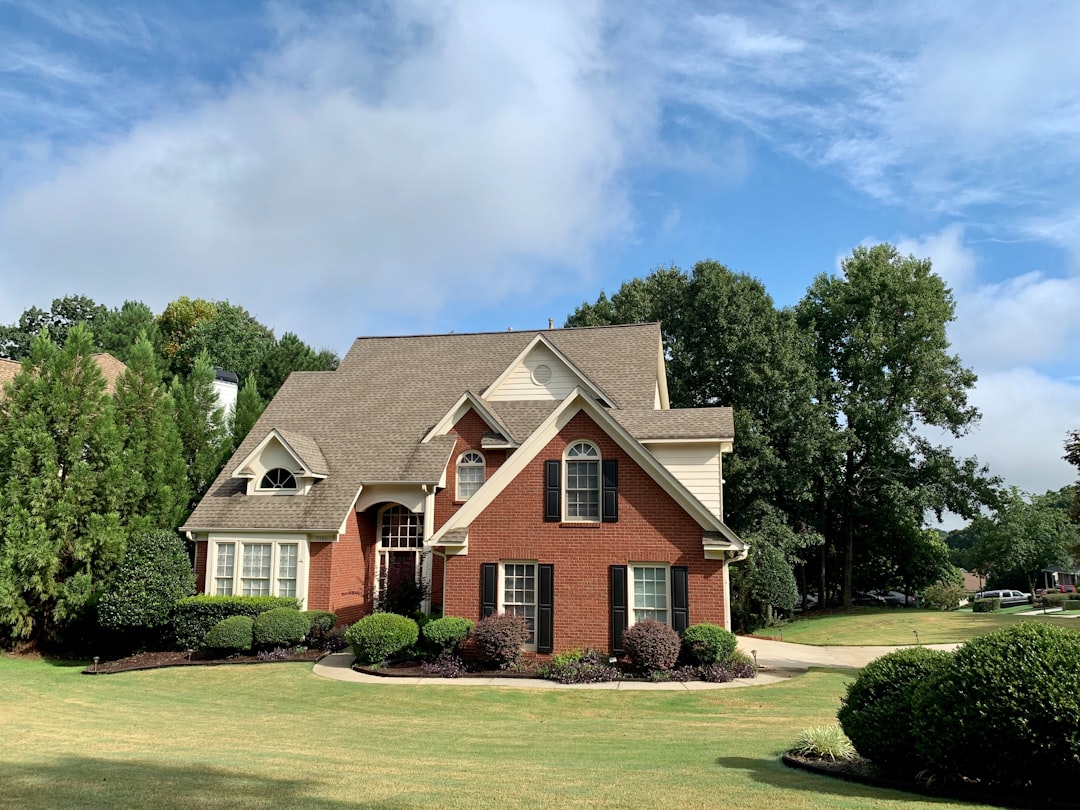 A brick home under blue sky